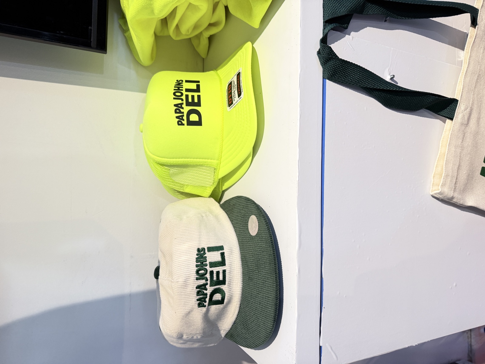 Finished shirts, hats, patches, and event merch for Live Embroidery Services